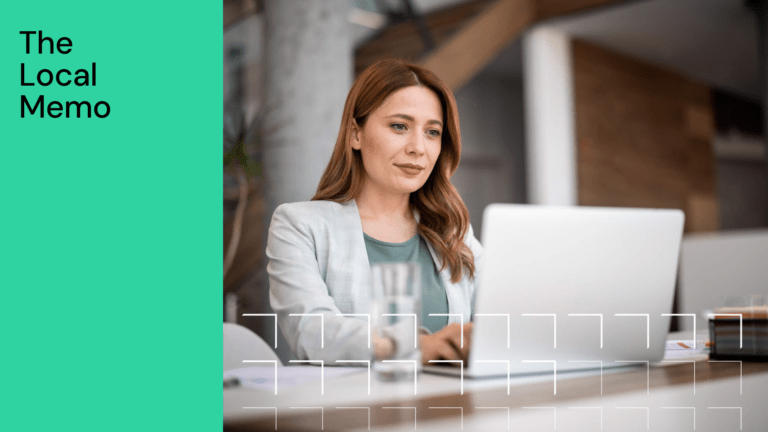 Woman with light brown hair working on a laptop in an office, with text The Local Memo on a green background.