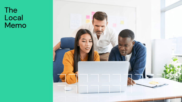 Diverse Team Collaborating on Project in Modern Office