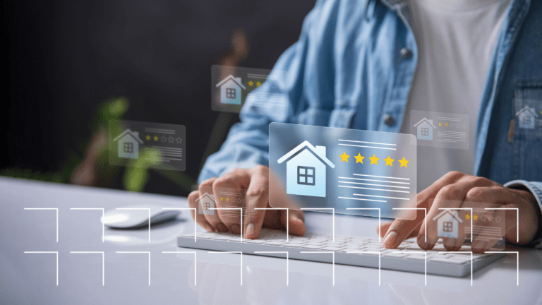 Person typing on a keyboard with digital icons of houses and star ratings overlaid, symbolizing online reviews.