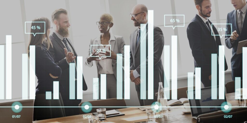 A business meeting with a group of people talking, overlaid with an illustration of bar graphs and percentages.